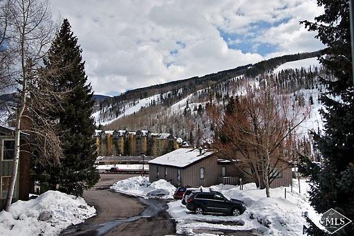 907 Red Sandstone Road, Unit 9C Vail, CO 81657 - Photo 7 of 7 a view of a patio with chair and tables