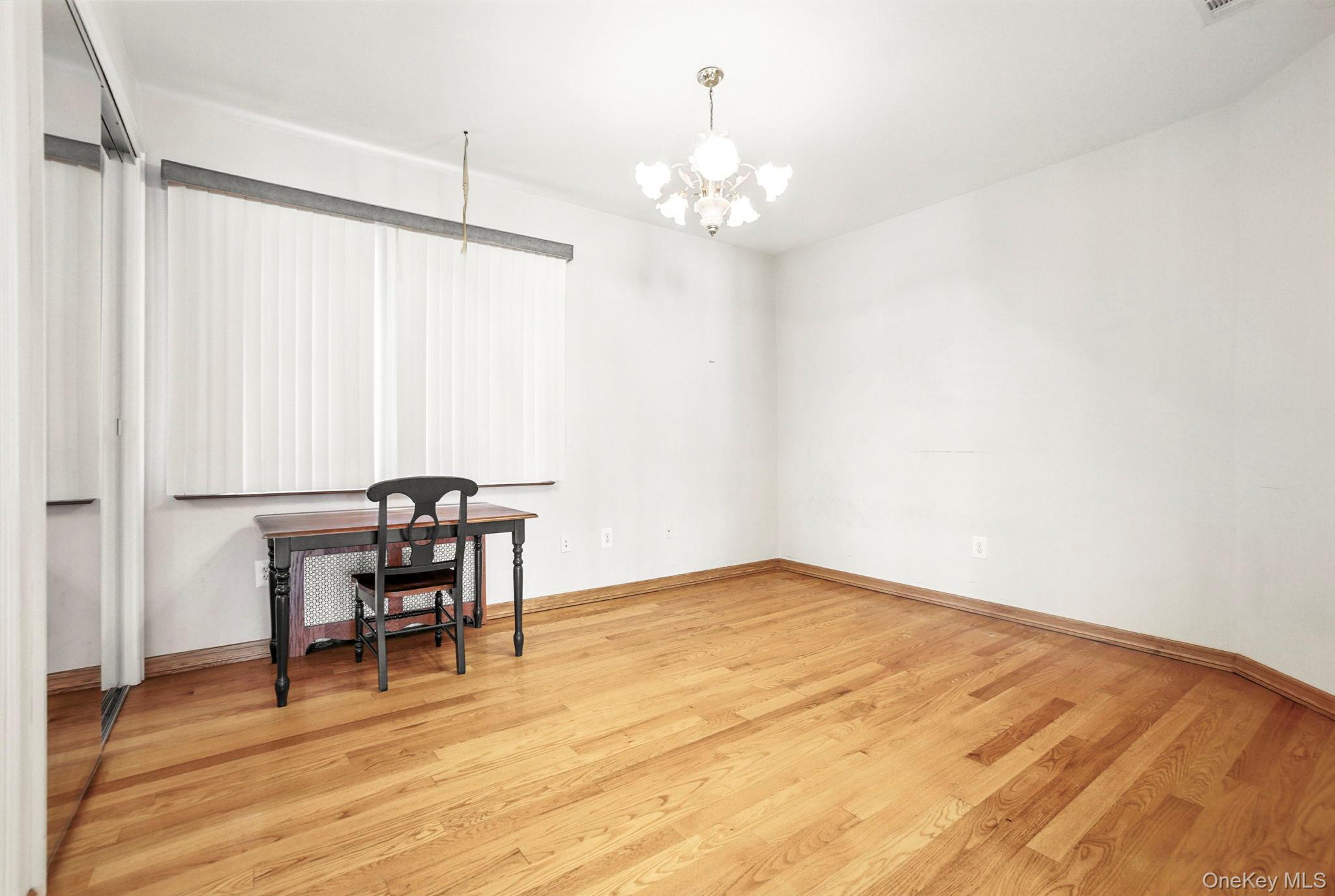 77-16 Kew Forest Lane Queens, NY 11375 - Photo 15 of 28 a view of a livingroom with furniture and wooden floor