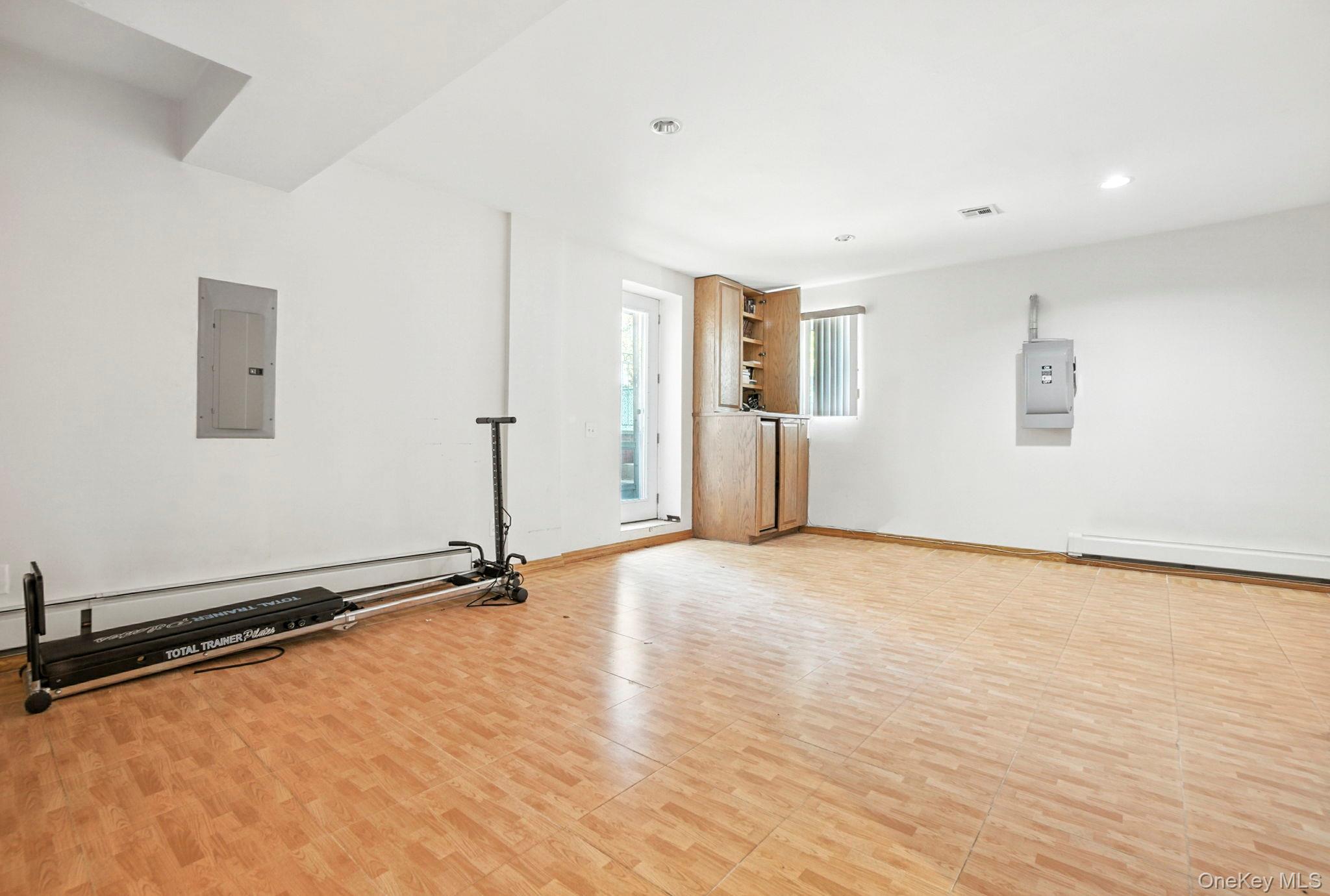 77-16 Kew Forest Lane Queens, NY 11375 - Photo 23 of 28 a view of a room with wooden floor