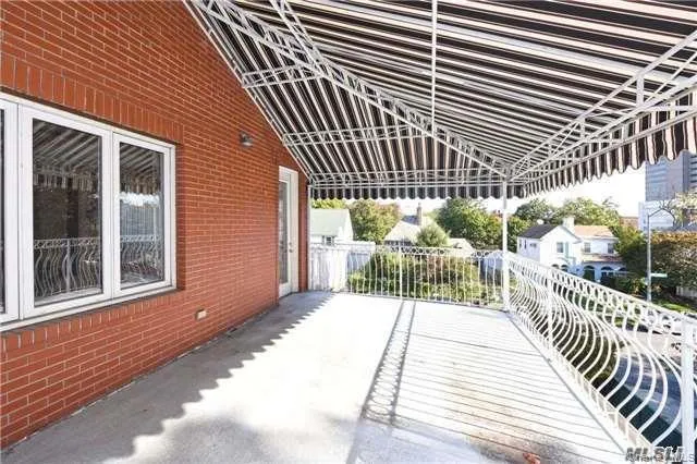 a view of a chair and table in the balcony