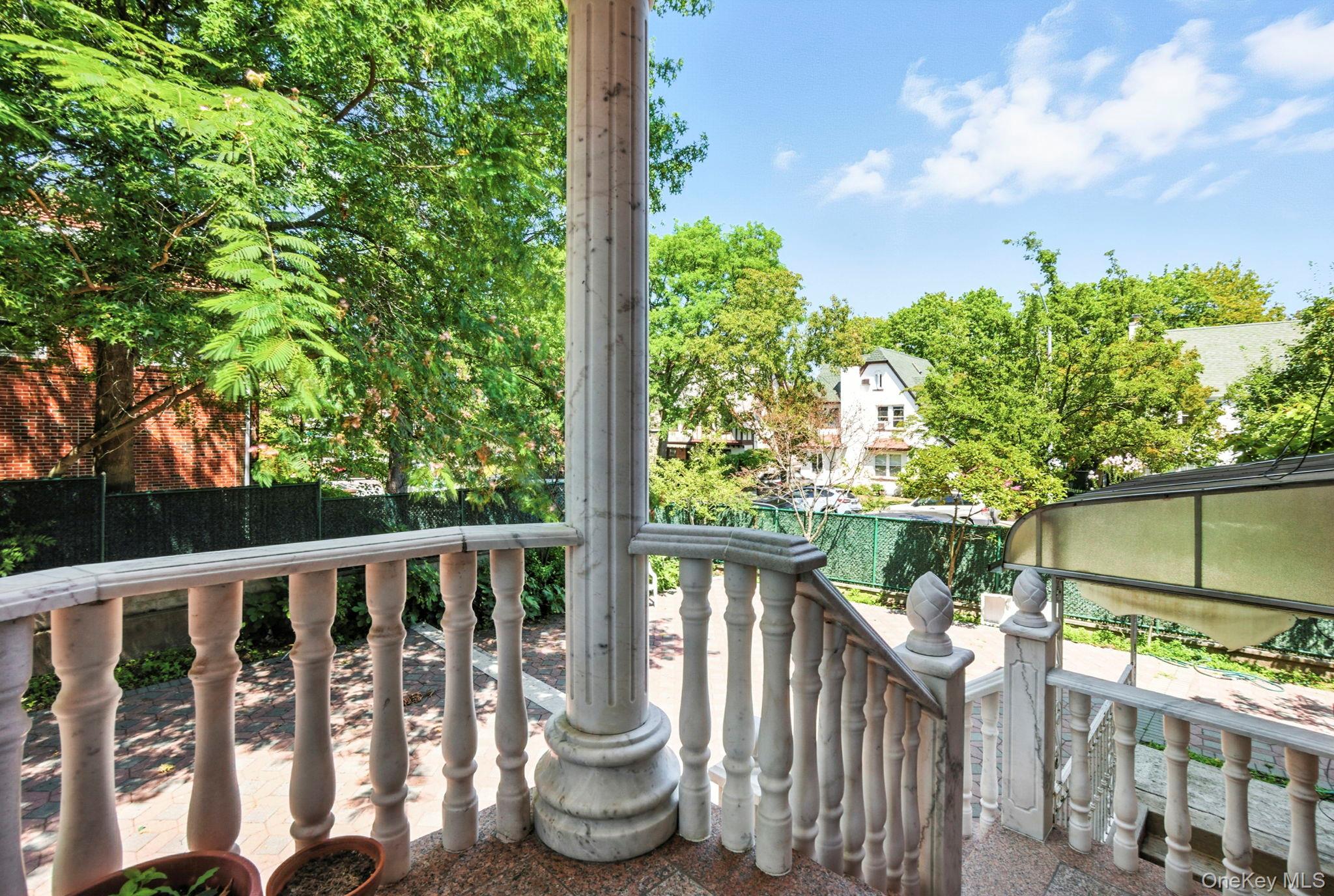 77-16 Kew Forest Lane Queens, NY 11375 - Photo 25 of 28 a view of a chair and table in the balcony