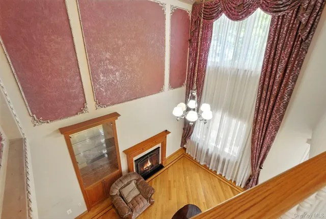 a view of a livingroom with wooden floor and door