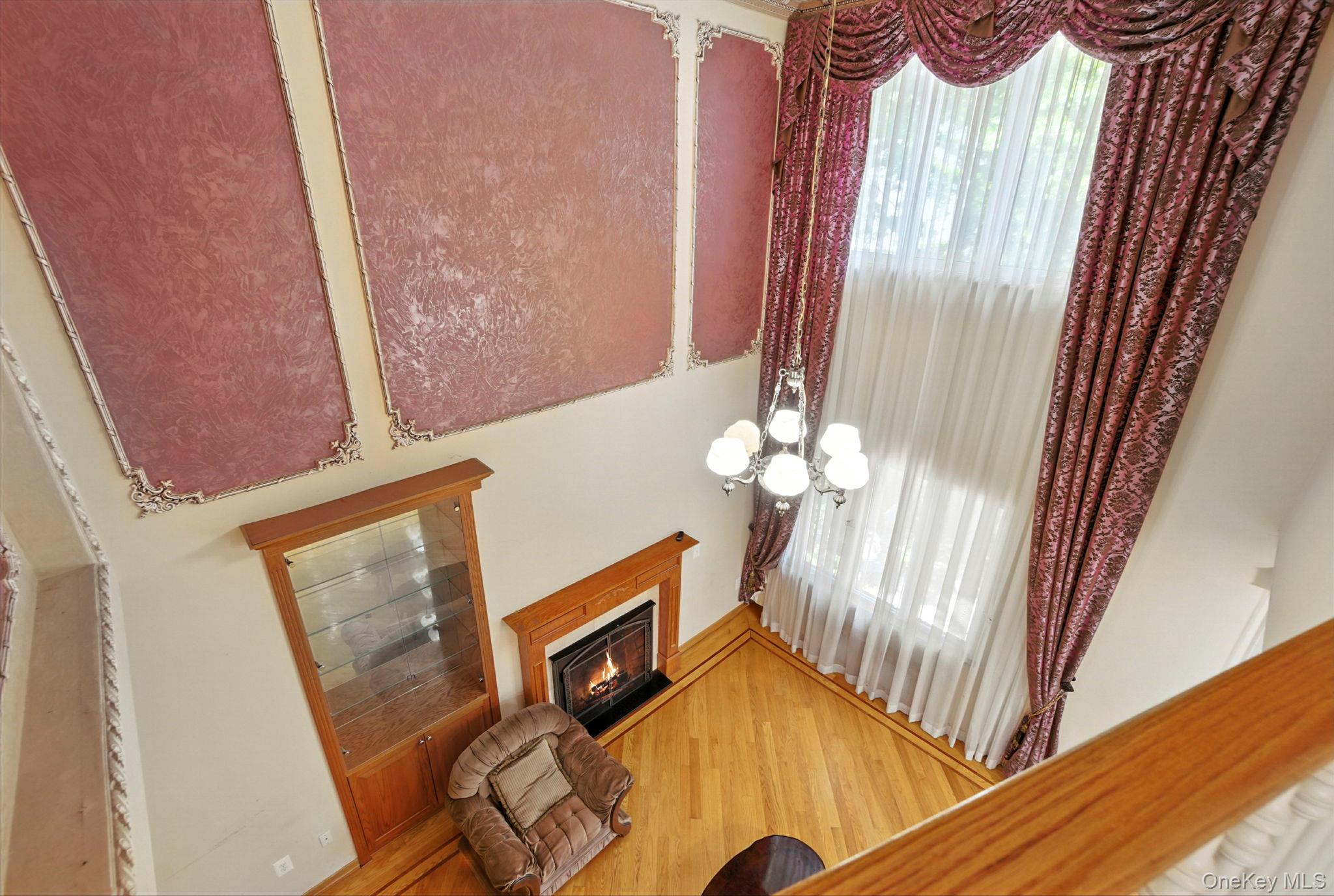 77-16 Kew Forest Lane Queens, NY 11375 - Photo 7 of 28 a view of a livingroom with wooden floor and door