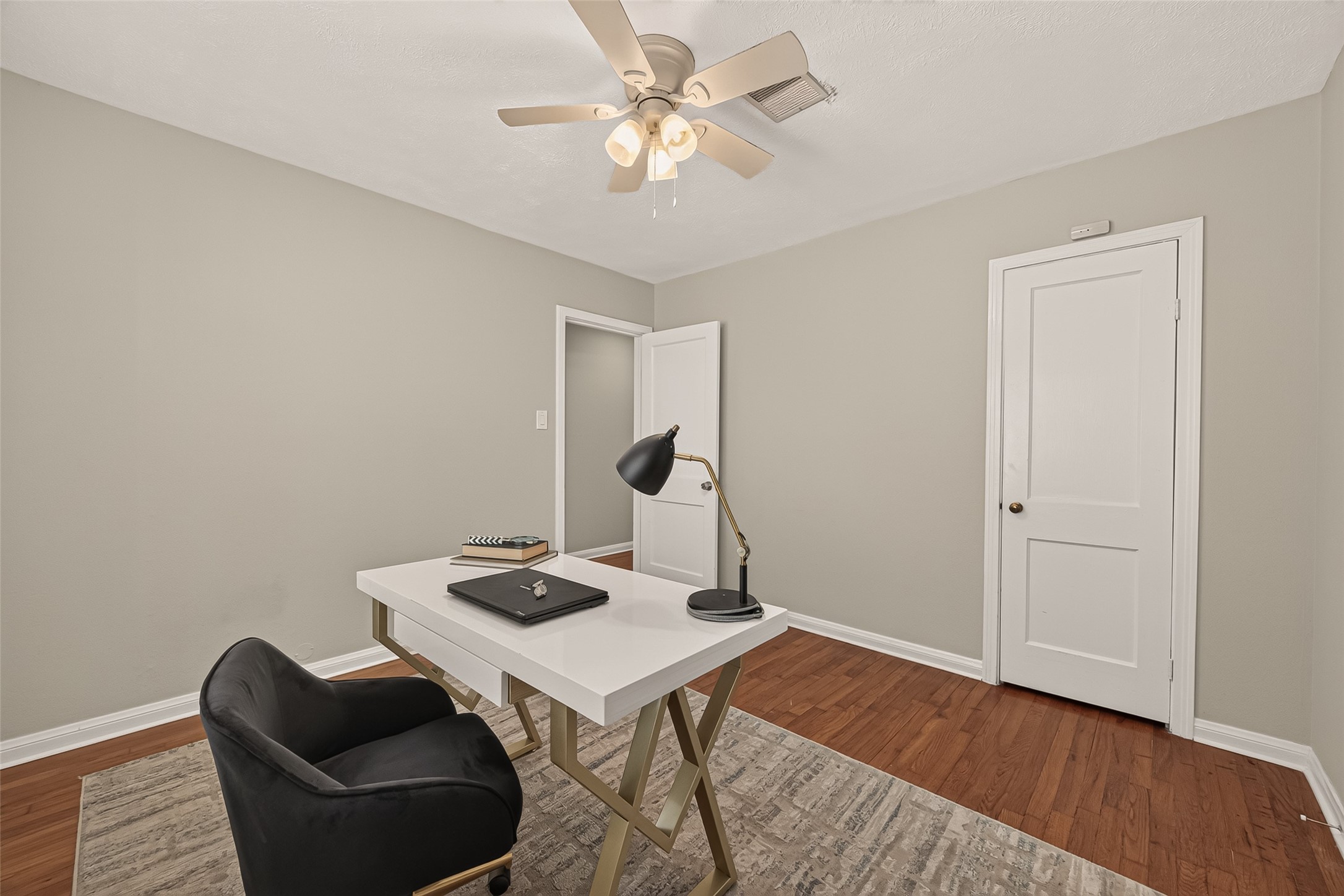2019 Gostick Street Houston, TX 77008 - Photo 23 of 36 a view of a workspace with furniture and wooden floor