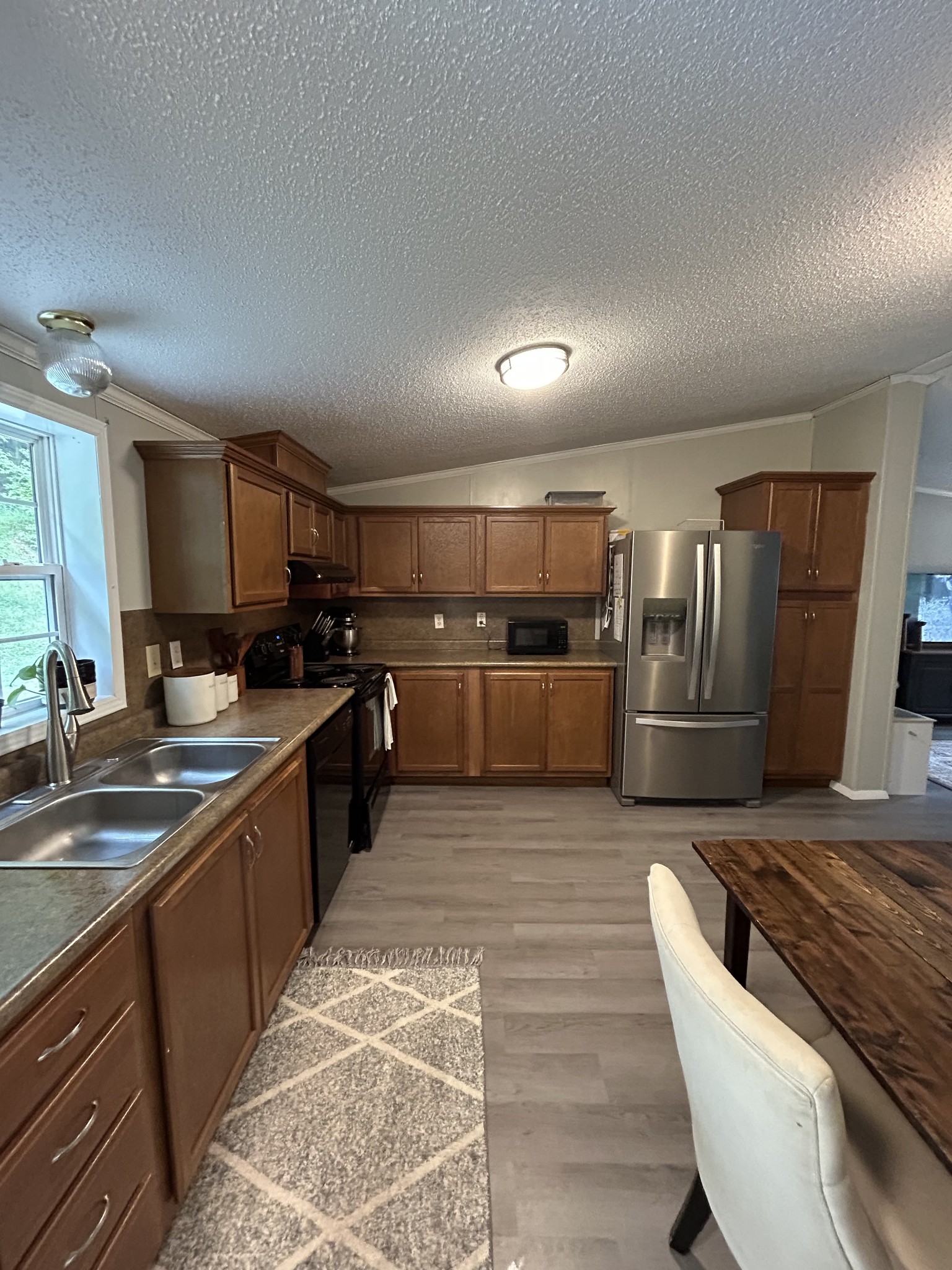 1100 Happy Valley Road Buffalo Valley, TN 38548 - Photo 16 of 27 a large kitchen with lots of counter space and stainless steel appliances