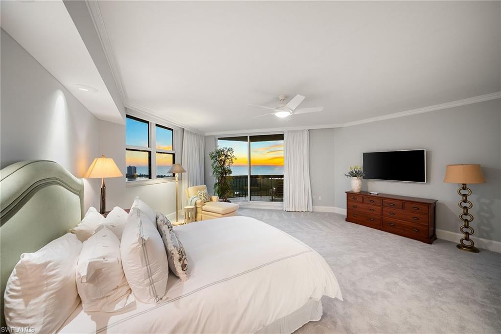 6001 Pelican Bay Boulevard, Unit PHA Naples, FL 34108 - Photo 4 of 50 a bedroom with a bed and a flat screen television