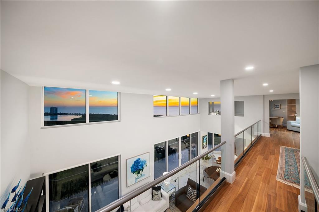6001 Pelican Bay Boulevard, Unit PHA Naples, FL 34108 - Photo 5 of 50 a view of a living room and dining room