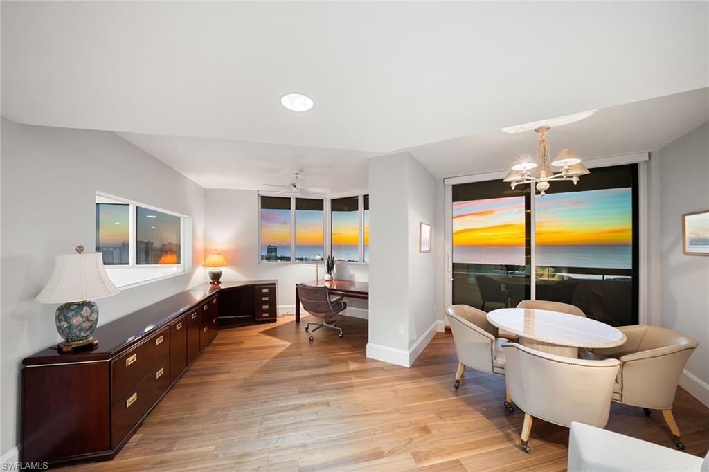 6001 Pelican Bay Boulevard, Unit PHA Naples, FL 34108 - Photo 6 of 50 a view of a dining room with furniture and chandelier