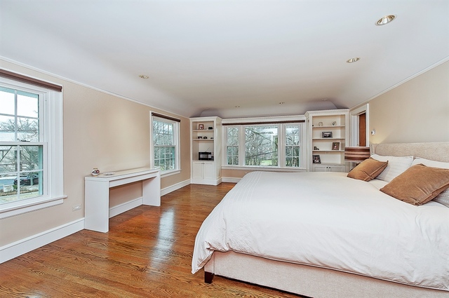 210 Franklin Road Glencoe, IL 60022 - Photo 16 of 20 a spacious bedroom with a large bed and wooden floor