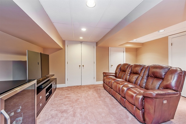 210 Franklin Road Glencoe, IL 60022 - Photo 19 of 20 a large living room with a couch and a stove top oven