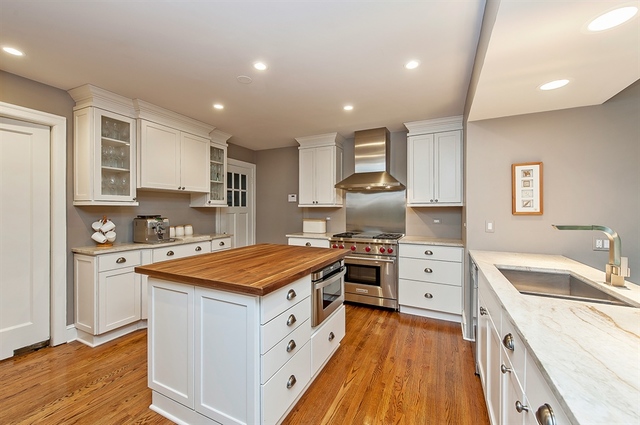 210 Franklin Road Glencoe, IL 60022 - Photo 7 of 20 a kitchen with stainless steel appliances granite countertop a sink stove and refrigerator