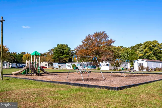a view of a swimming pool with outdoor seating