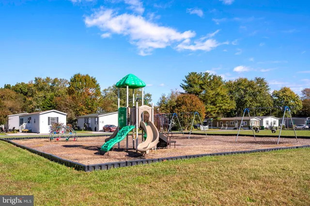 a view of a park with swings and slides