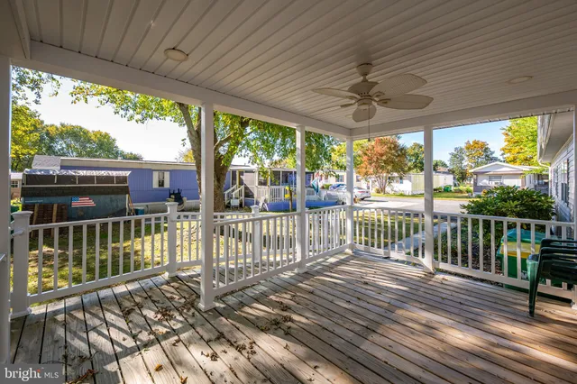 a view of a two chairs in the balcony