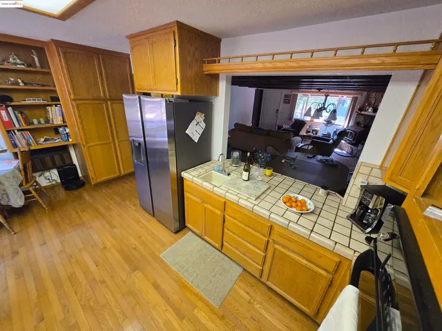 a view of a kitchen with a sink and a microwave