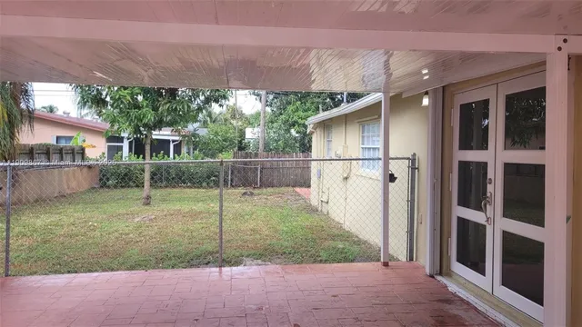 a backyard of a house with plants