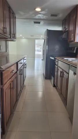 a hallway with cabinets