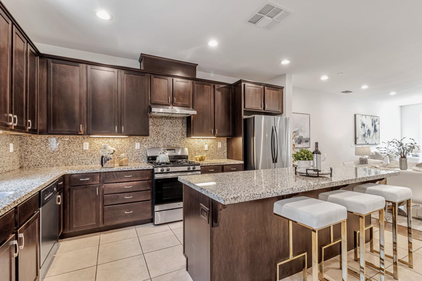 500 Lapin Place Hayward, CA 94541 - Photo 11 of 36 a kitchen with stainless steel appliances granite countertop a sink stove and refrigerator