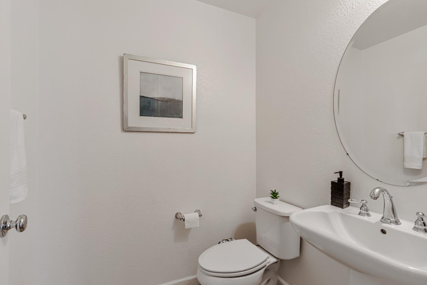 500 Lapin Place Hayward, CA 94541 - Photo 21 of 36 a white toilet sitting next to a bathroom sink