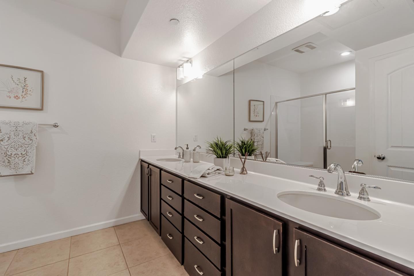 500 Lapin Place Hayward, CA 94541 - Photo 26 of 36 a bathroom with double vanity sinks and a mirror