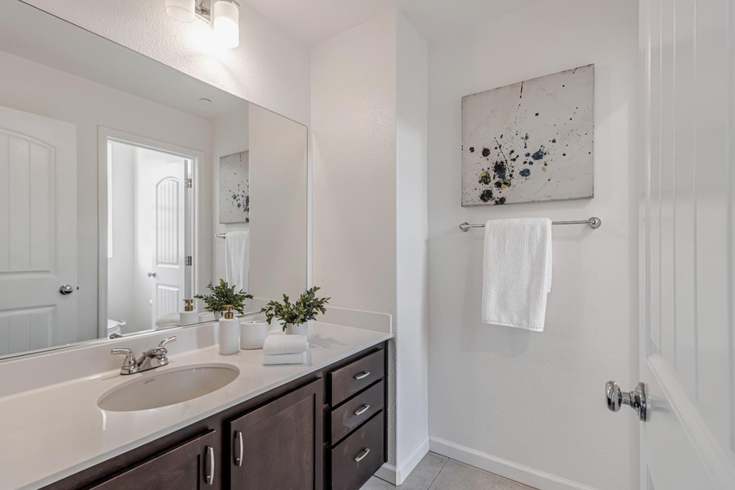 500 Lapin Place Hayward, CA 94541 - Photo 31 of 36 a bathroom with a granite countertop sink and a mirror