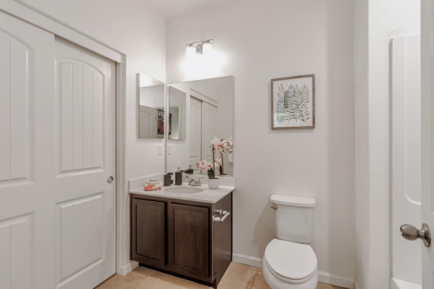 500 Lapin Place Hayward, CA 94541 - Photo 10 of 36 a bathroom with a toilet sink vanity and mirror
