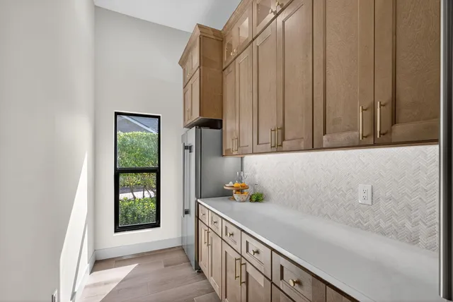 a bathroom with a sink and a window