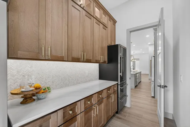 a kitchen with a sink and refrigerator