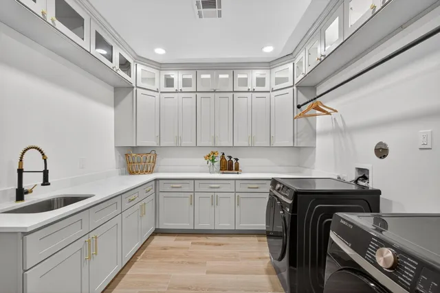 a kitchen with a sink and cabinets
