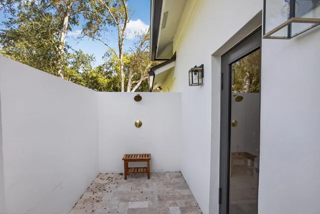 a view of a house with a potted plant
