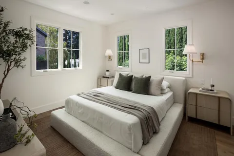 a bedroom with bed and window