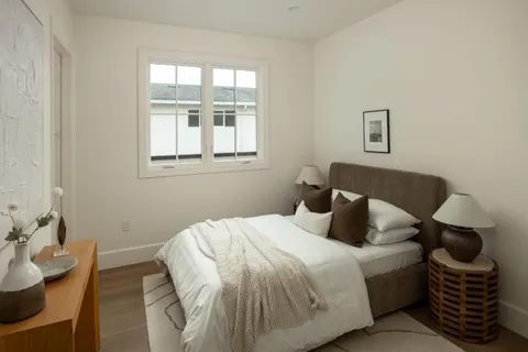 a bedroom with a bed and window