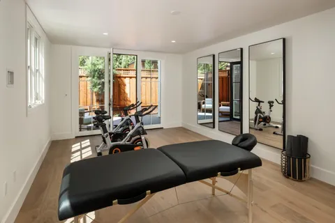 a view of a room with furniture and a window