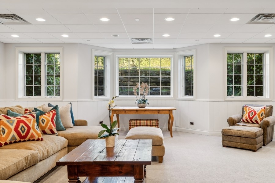 81 Locust Road Winnetka, IL 60093 - Photo 54 of 64 a living room with furniture and a large window
