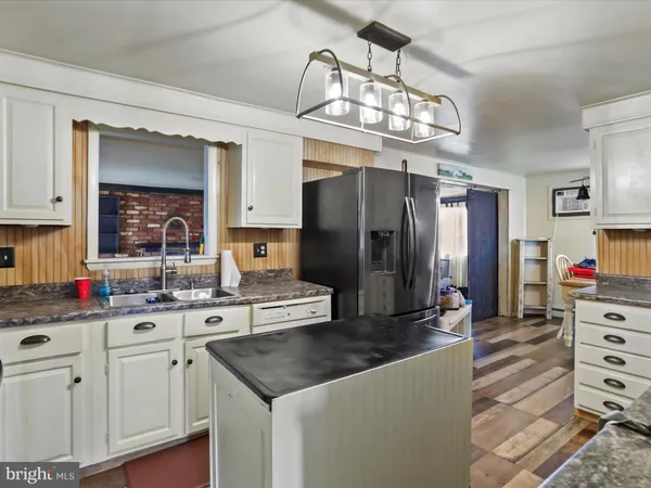a kitchen with cabinets and stainless steel appliances
