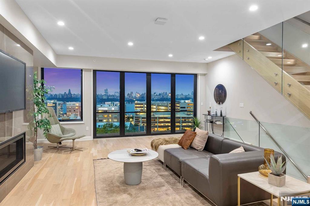 8822 Churchill Road North Bergen, NJ 07047 - Photo 32 of 50 a living room with furniture and a large window