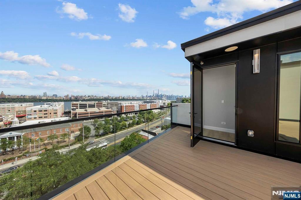 8822 Churchill Road North Bergen, NJ 07047 - Photo 44 of 50 a view of a balcony with wooden floor