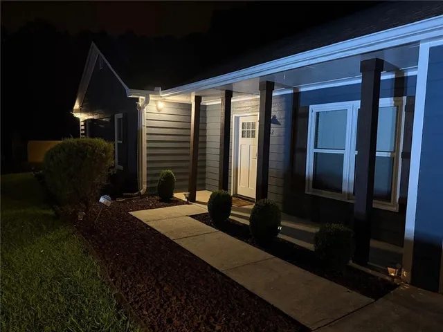 a balcony view with a sitting space