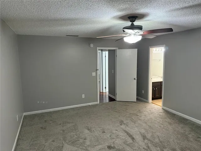 a bathroom with a toilet and a bathtub