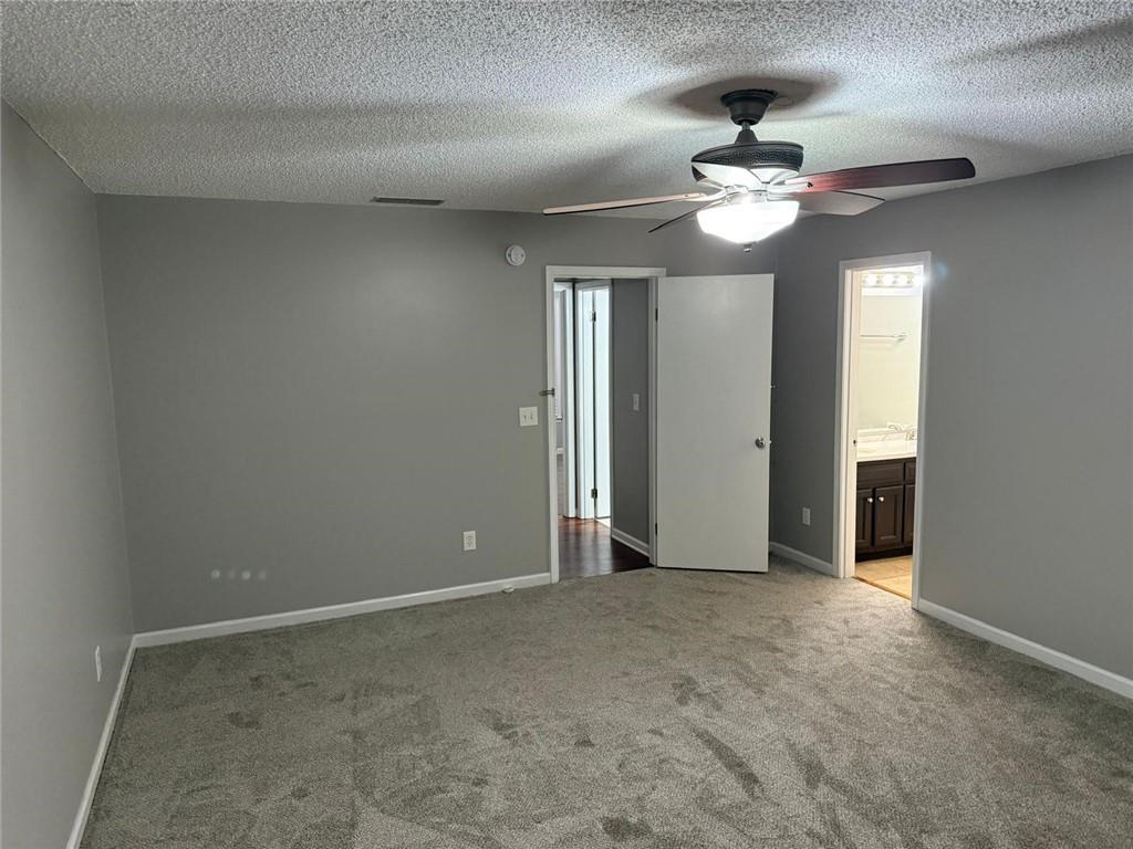 1682 Greyleaf Lane Southeast Dacula, GA 30019 - Photo 13 of 23 wooden floor in an empty room