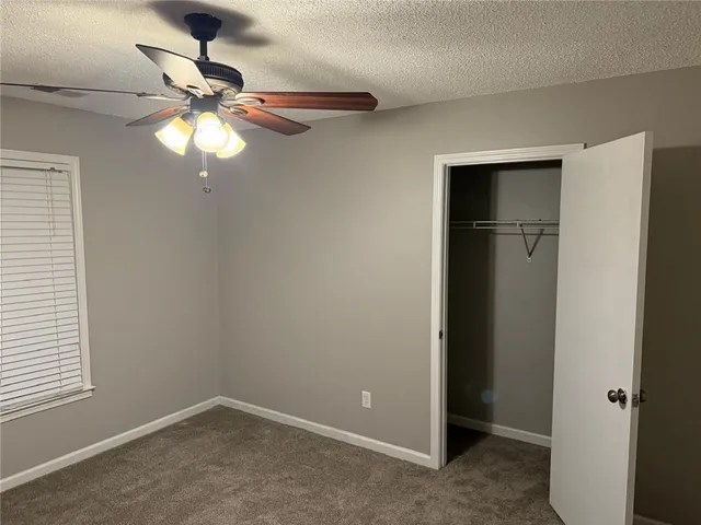 a bathroom with double vanity sinks and a mirror