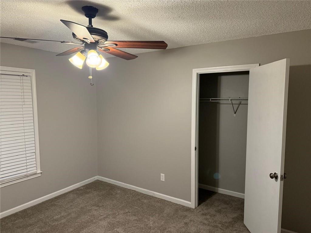1682 Greyleaf Lane Southeast Dacula, GA 30019 - Photo 15 of 23 a view of a chandelier fan and a window