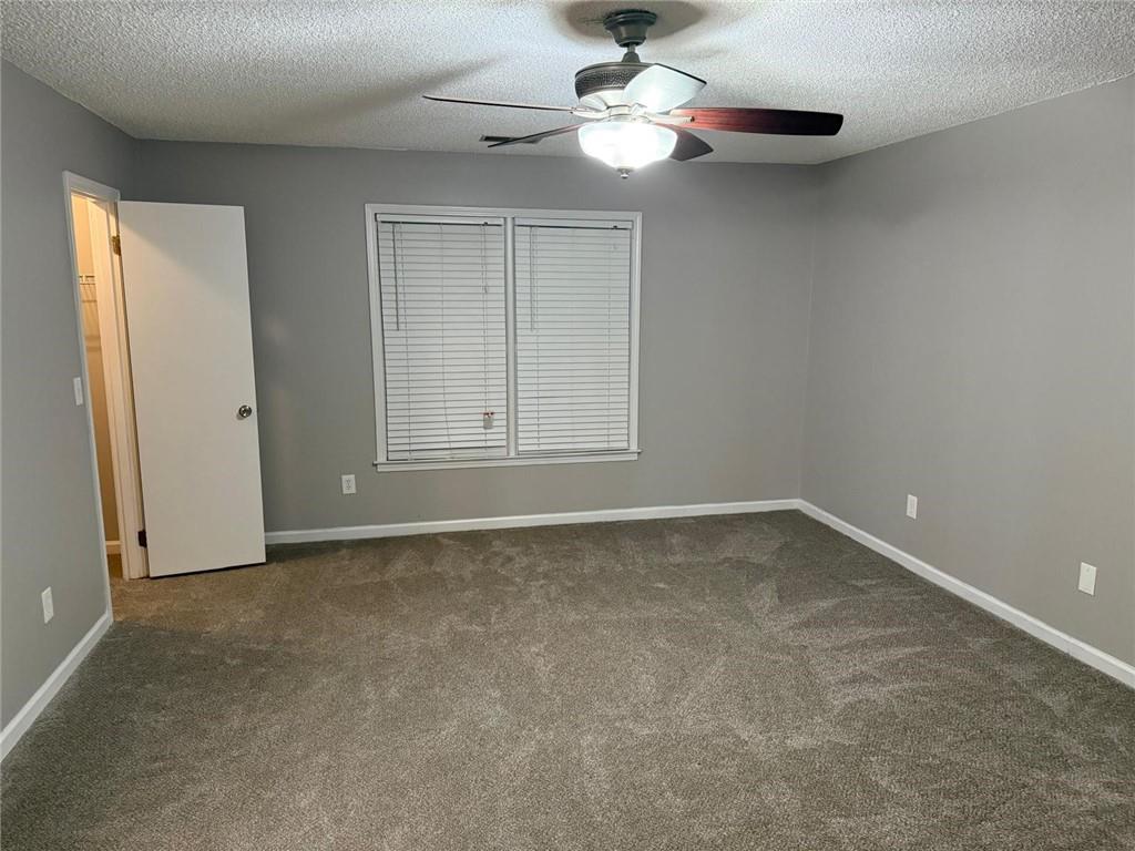 1682 Greyleaf Lane Southeast Dacula, GA 30019 - Photo 17 of 23 a view of an empty room with a window