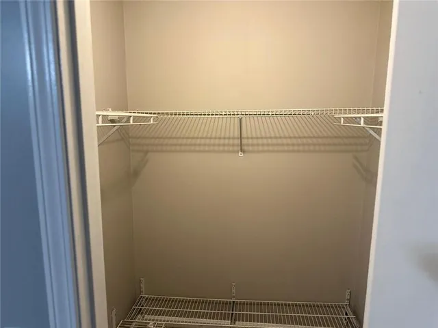 a view of wooden floor and brick walls