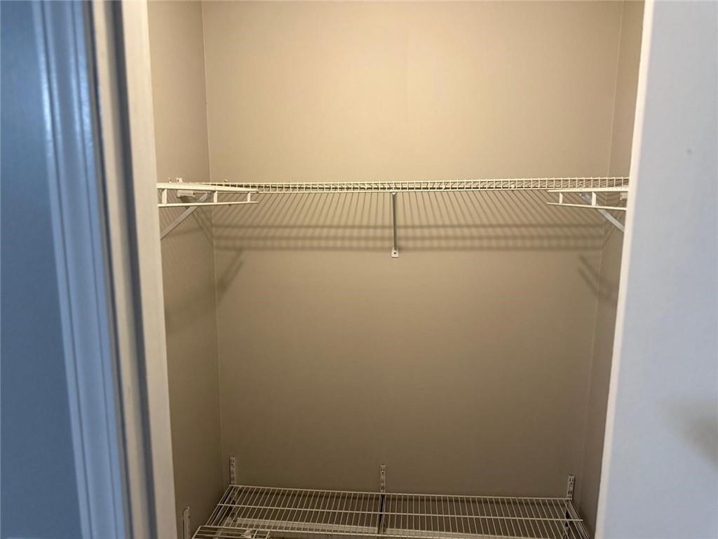 1682 Greyleaf Lane Southeast Dacula, GA 30019 - Photo 19 of 23 a view of a room with racks on the wall