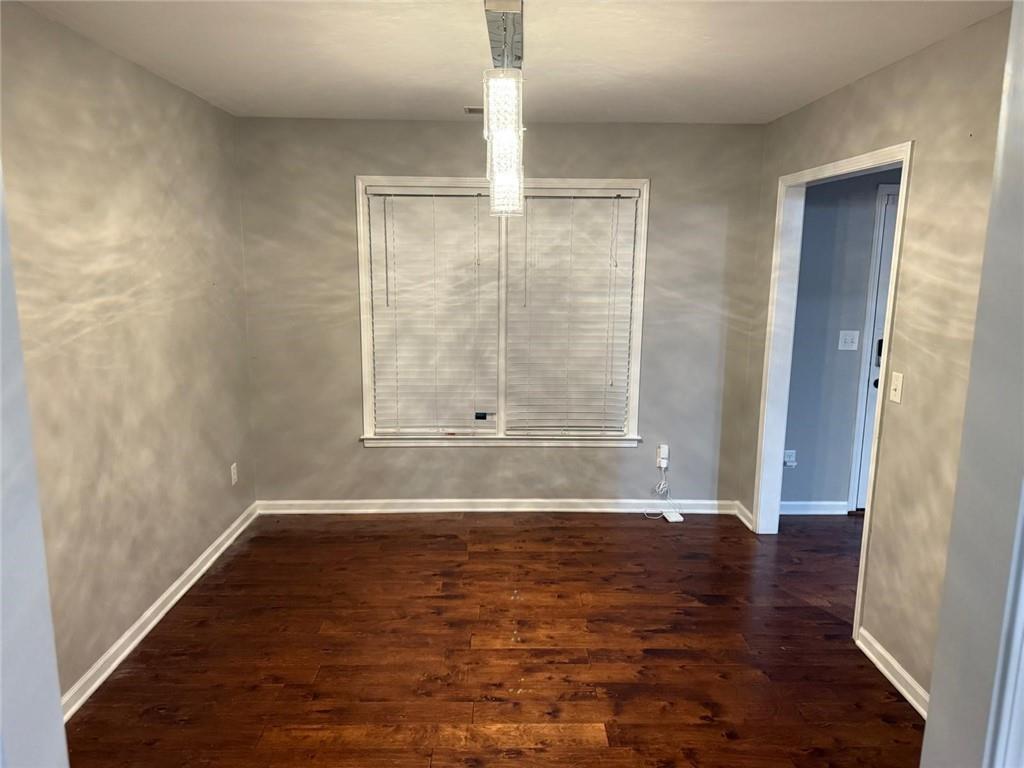 1682 Greyleaf Lane Southeast Dacula, GA 30019 - Photo 20 of 23 a view of wooden floor and brick walls