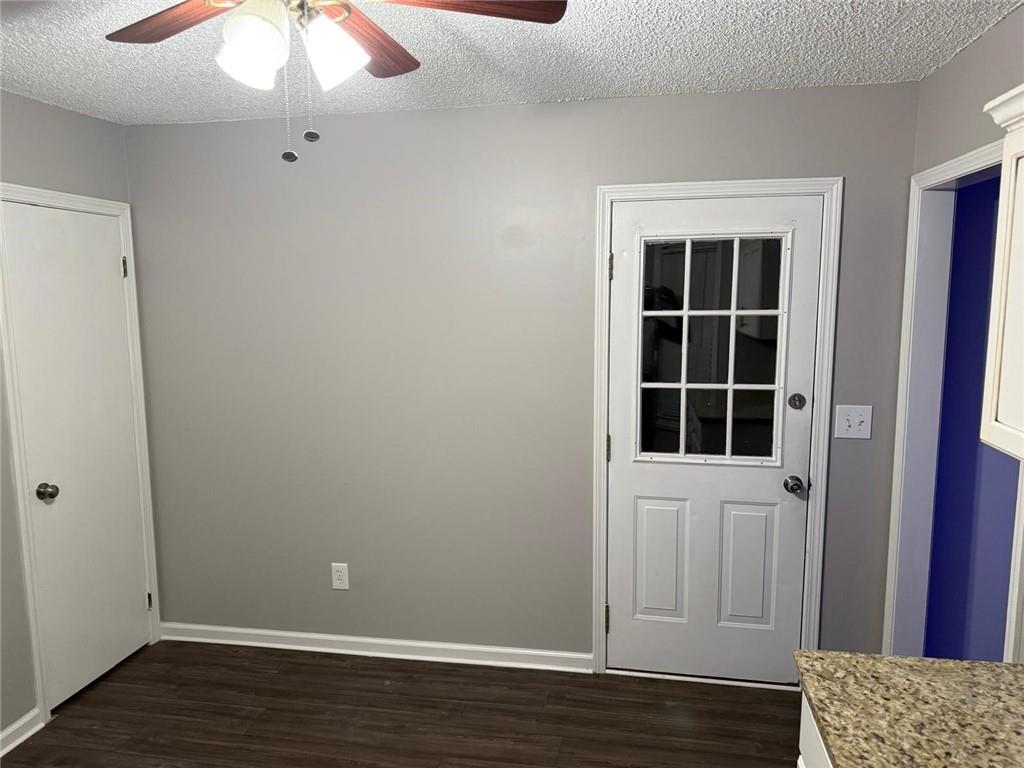 1682 Greyleaf Lane Southeast Dacula, GA 30019 - Photo 21 of 23 an empty room with wooden floor and windows