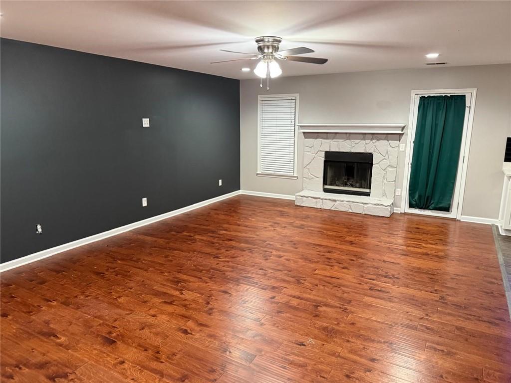 1682 Greyleaf Lane Southeast Dacula, GA 30019 - Photo 3 of 23 a view of empty room with fireplace and fan