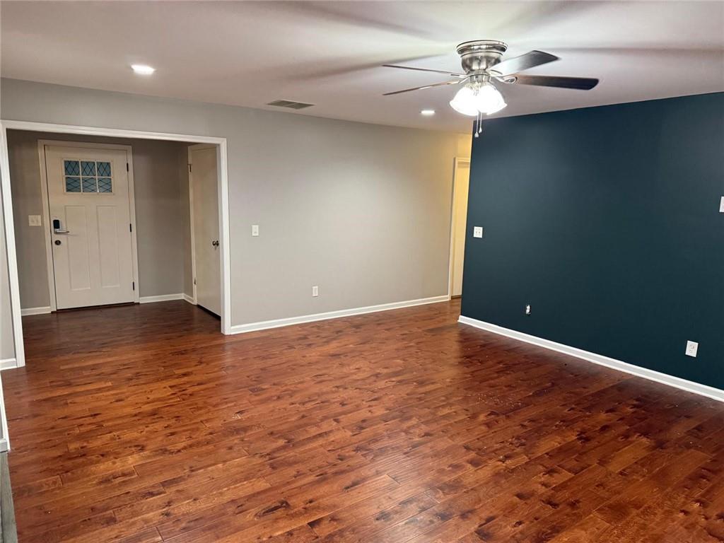 1682 Greyleaf Lane Southeast Dacula, GA 30019 - Photo 4 of 23 wooden floor in an empty room with a window