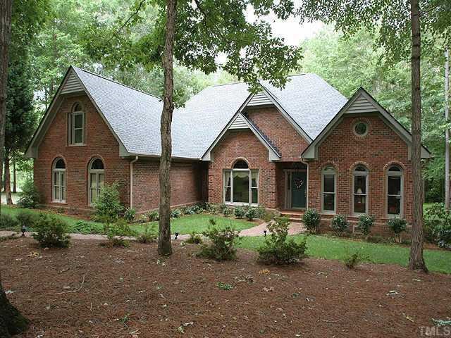 11001 Mason Ridge Drive Raleigh, NC 27614 - Photo 1 of 7 a front view of a house with garden